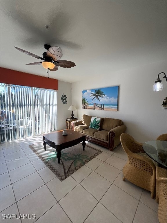 Living room with tile patterned floors and a ceiling fan
