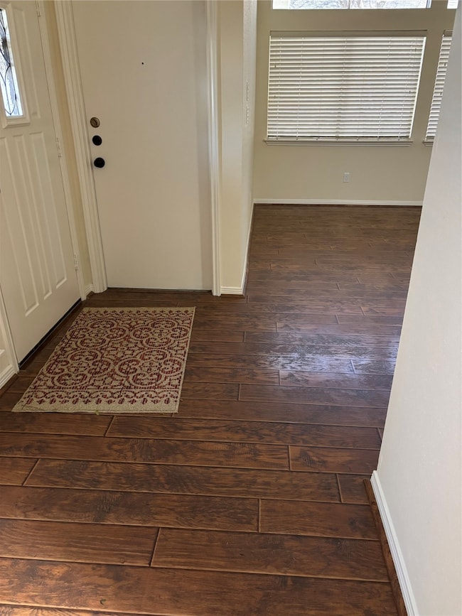 The entryway has a door leading to the garage or you can come right into the den.