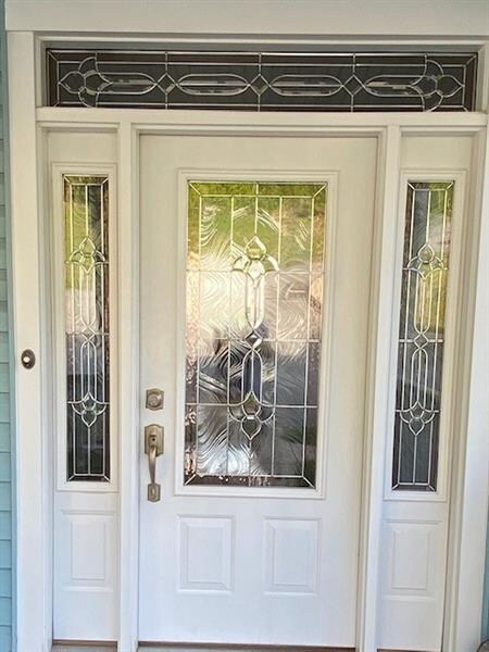 Eye-catching front door with sidelights and transom.