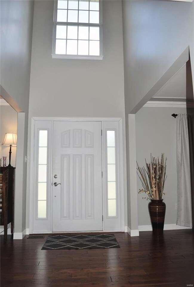 2 story foyer.  Hand-scraped hardwood floors throu