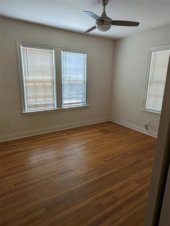 Spare room with dark wood-style flooring, a ceili