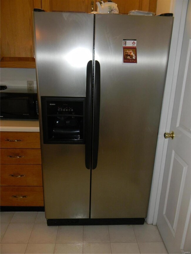 Stainless steel refrigerator with ice maker featur