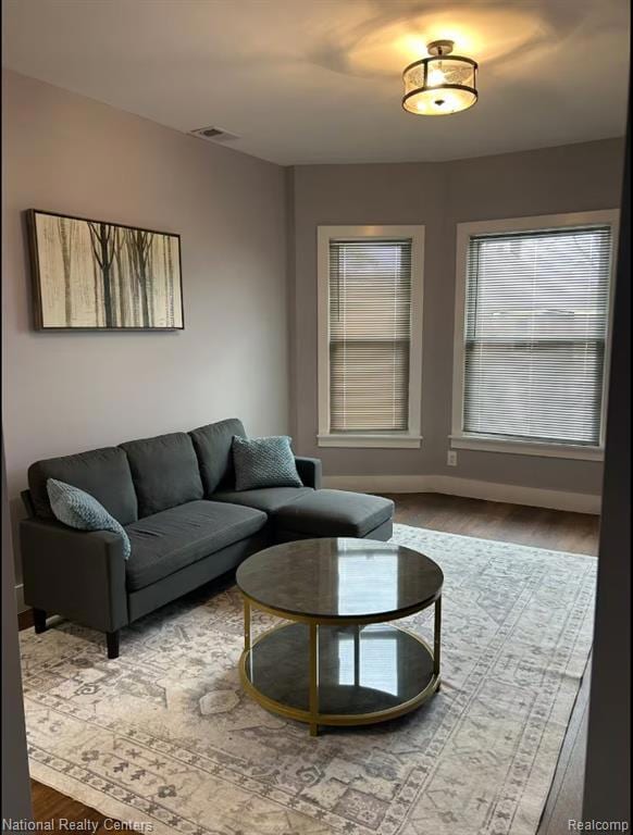 Living area featuring wood finished floors and baseboards
