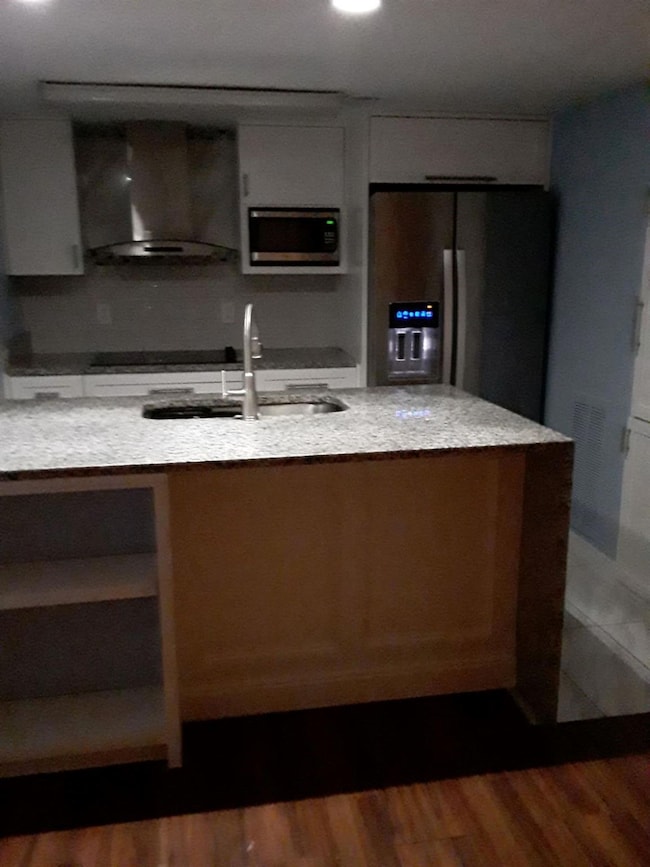 Kitchen with appliances with stainless steel finis