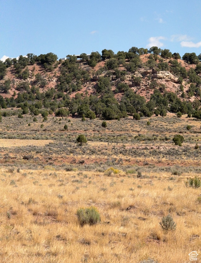 View of mountain background featuring rural landscape