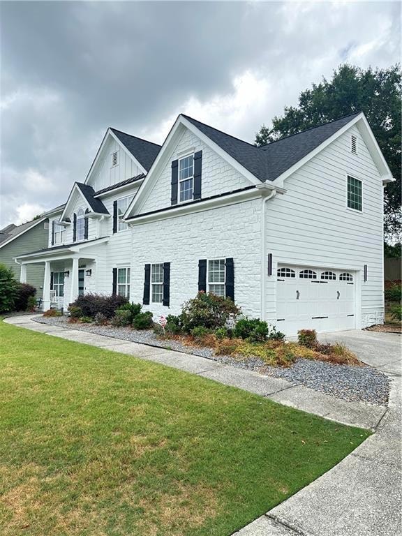 View of front of property with a garage and a fron