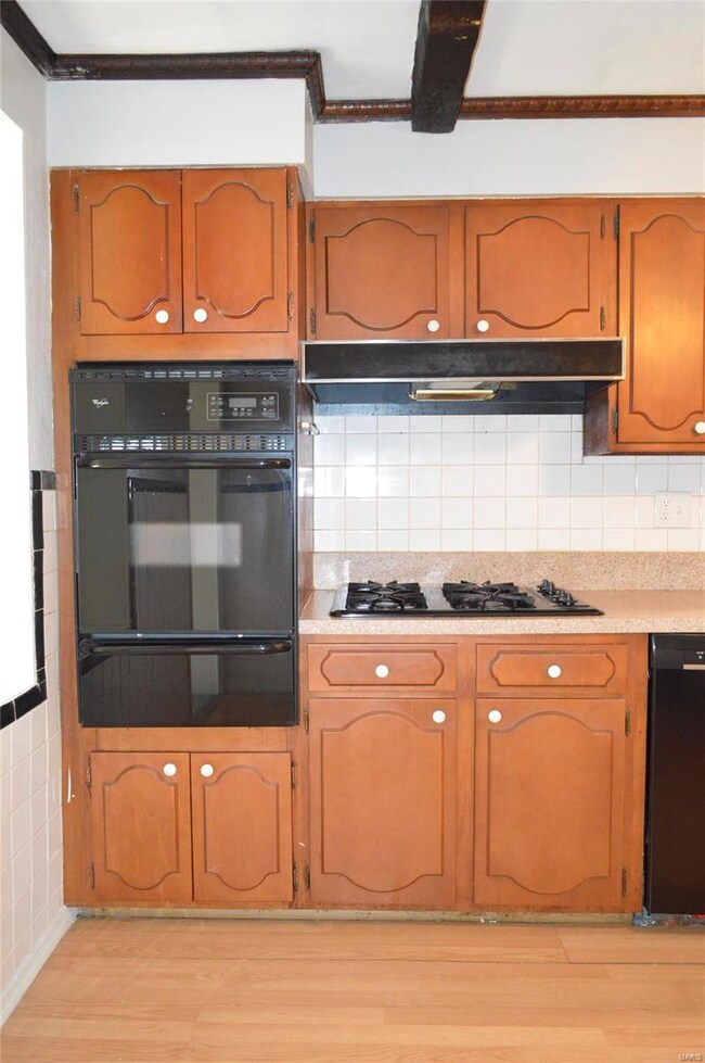 Beams on the ceiling, original tile work, plenty o