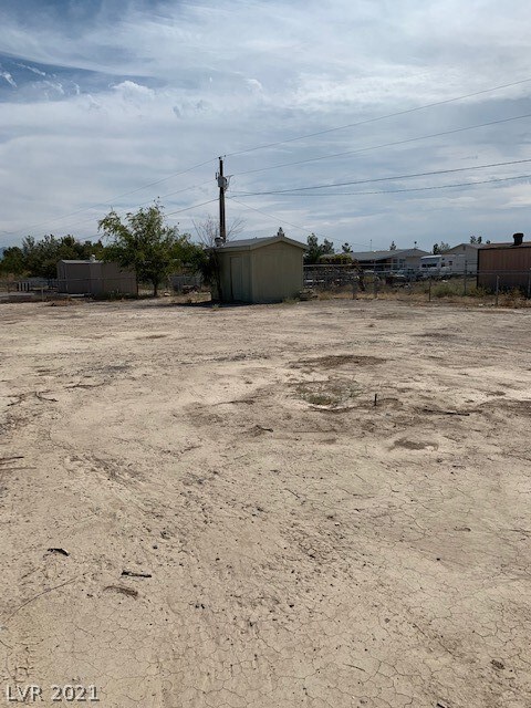 Well and pump house on corner of property.