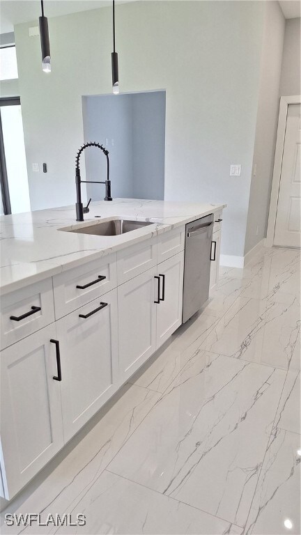 Kitchen with dishwashing machine, a sink, light ma