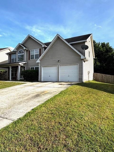 View of home's exterior featuring an attached garage and concrete driveway