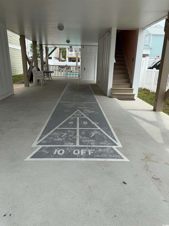 View of property's community with stairs, fence, a