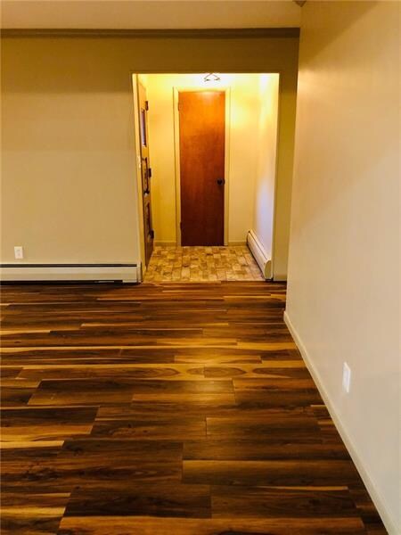 View of Edge of Living Room to Front Entry,  from the Eat in Kitchen area.