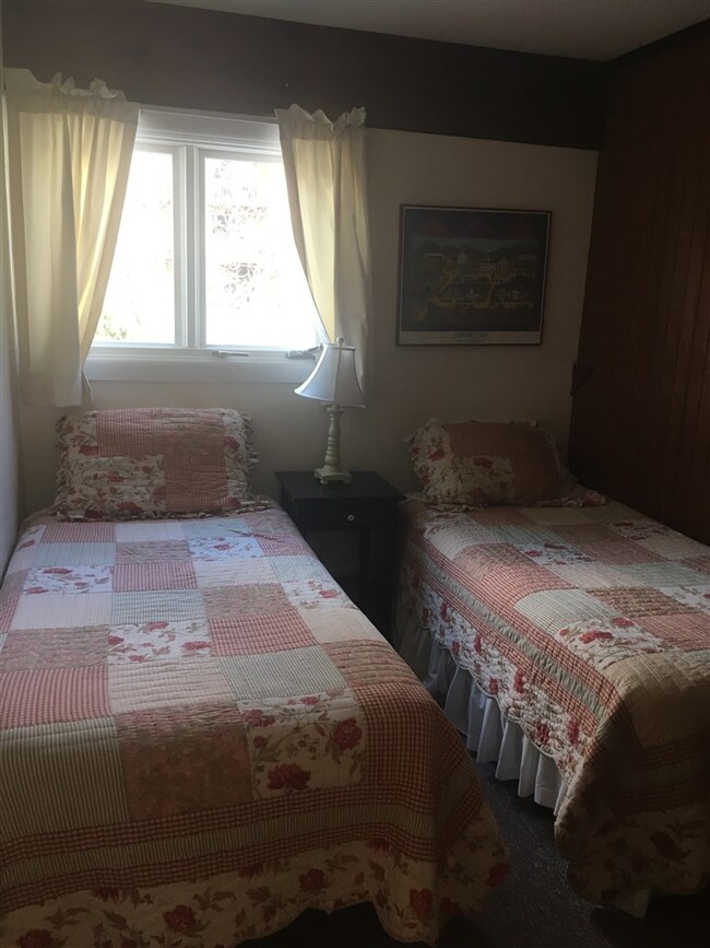 A second bedroom provides room for two twin beds o