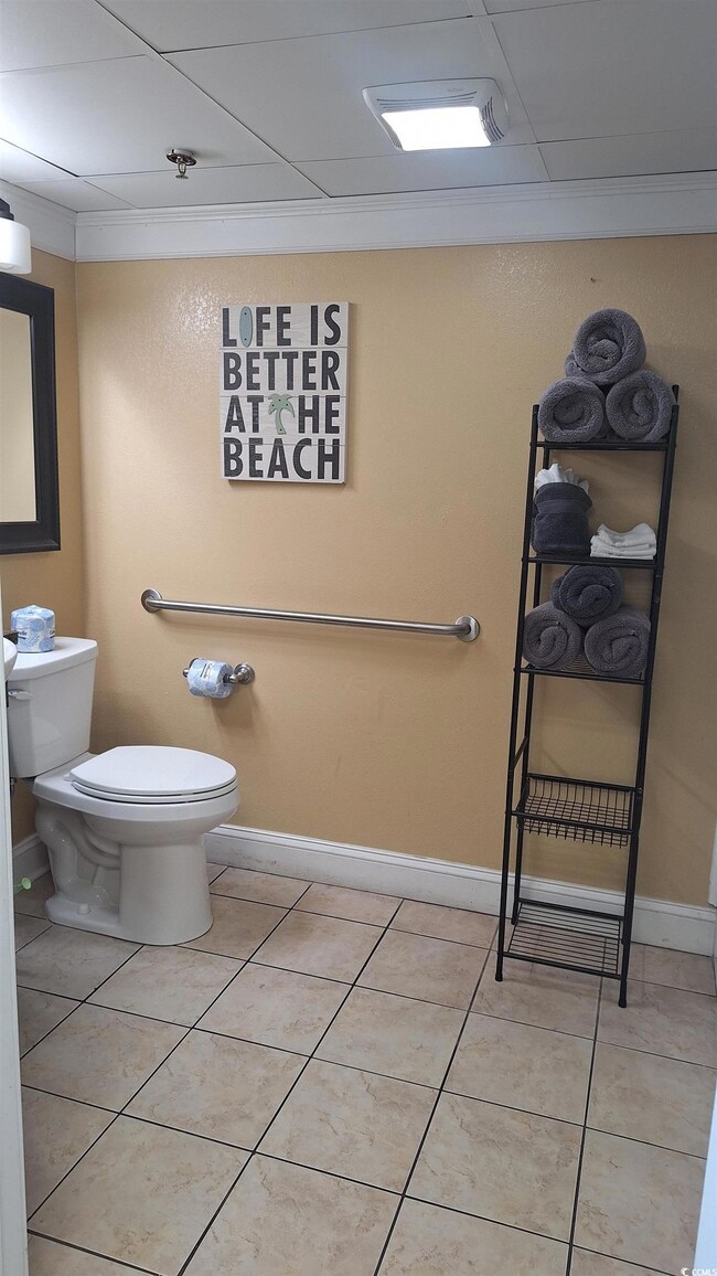 Half bathroom featuring tile patterned floors