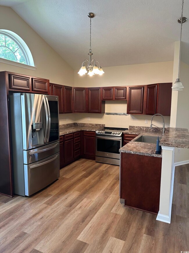 Kitchen featuring appliances with stainless steel 