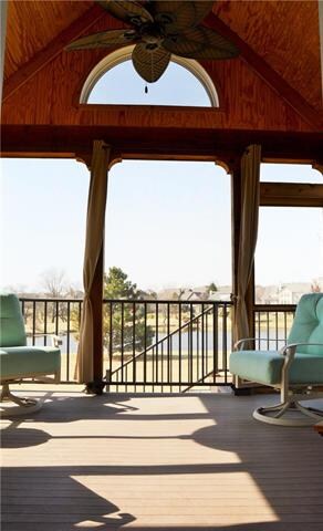 Screened in porch with ceiling fan and recessed li