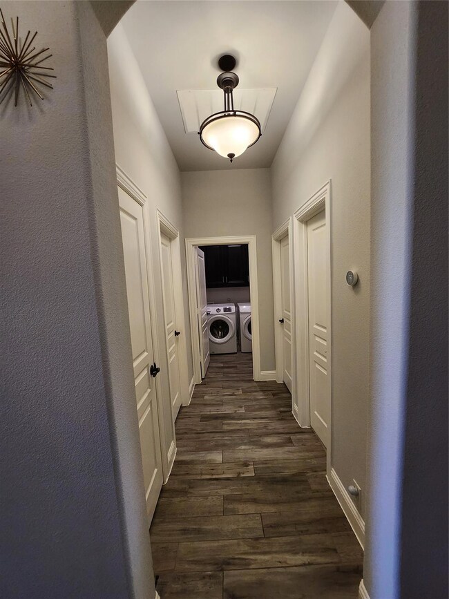 corridor leading to additional 2 bedrooms downstai