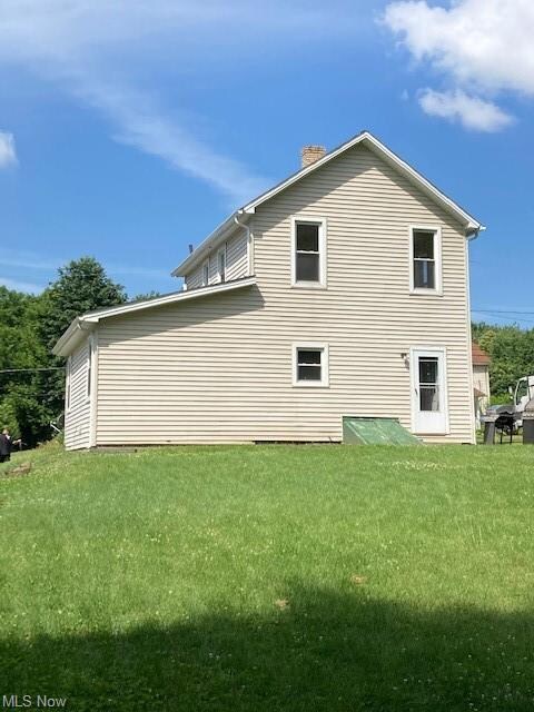 Rear of home with large yard