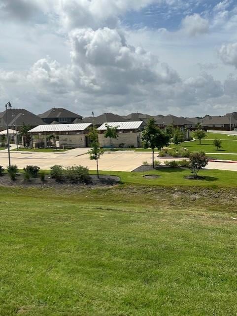 View of grassy yard with a residential view