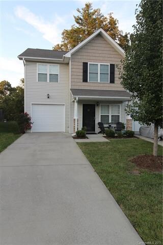 One car garage with parking for more in driveway.