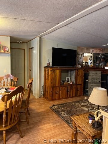 Open floor plan in dining, kitchen and living area