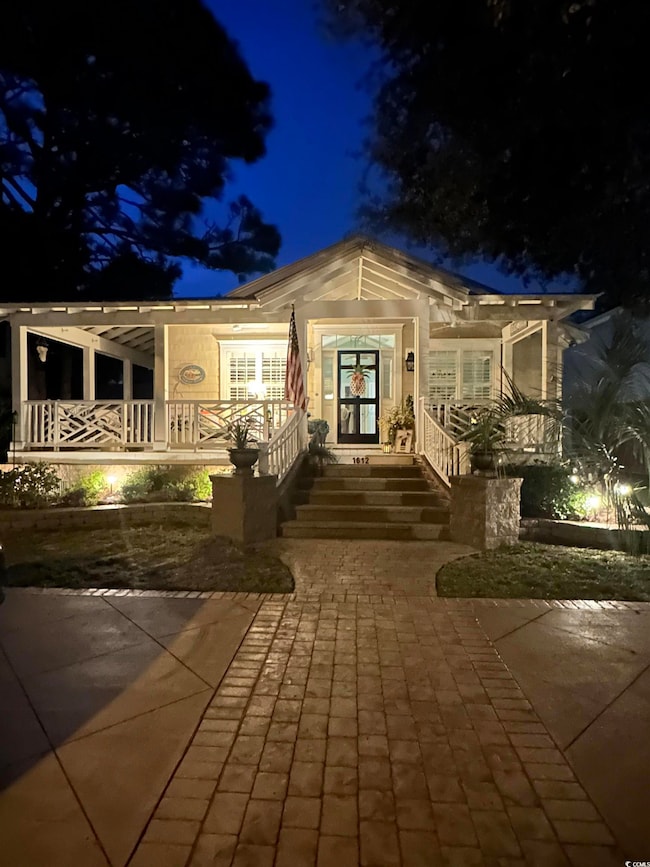 View of front of property featuring a porch