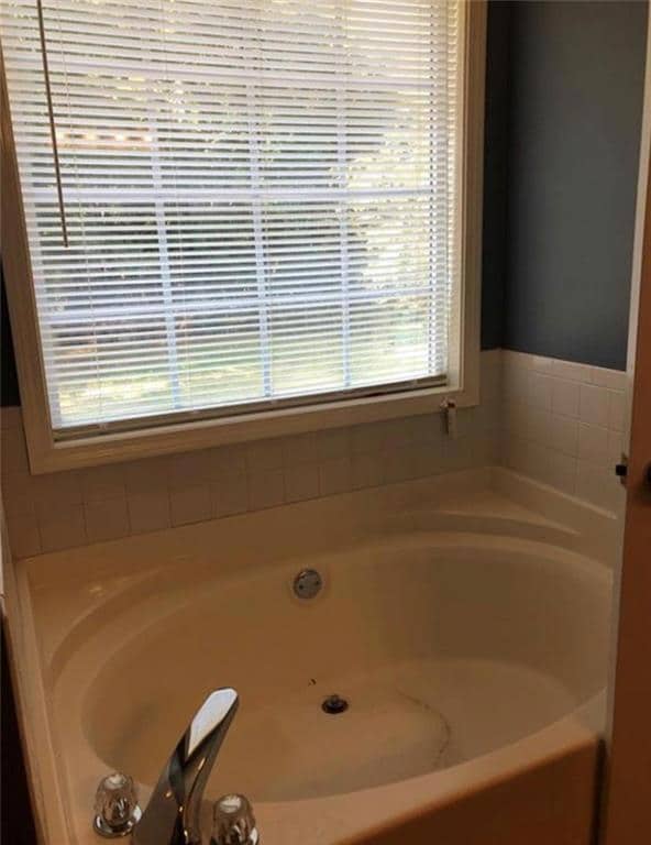 Full bath with a garden tub
