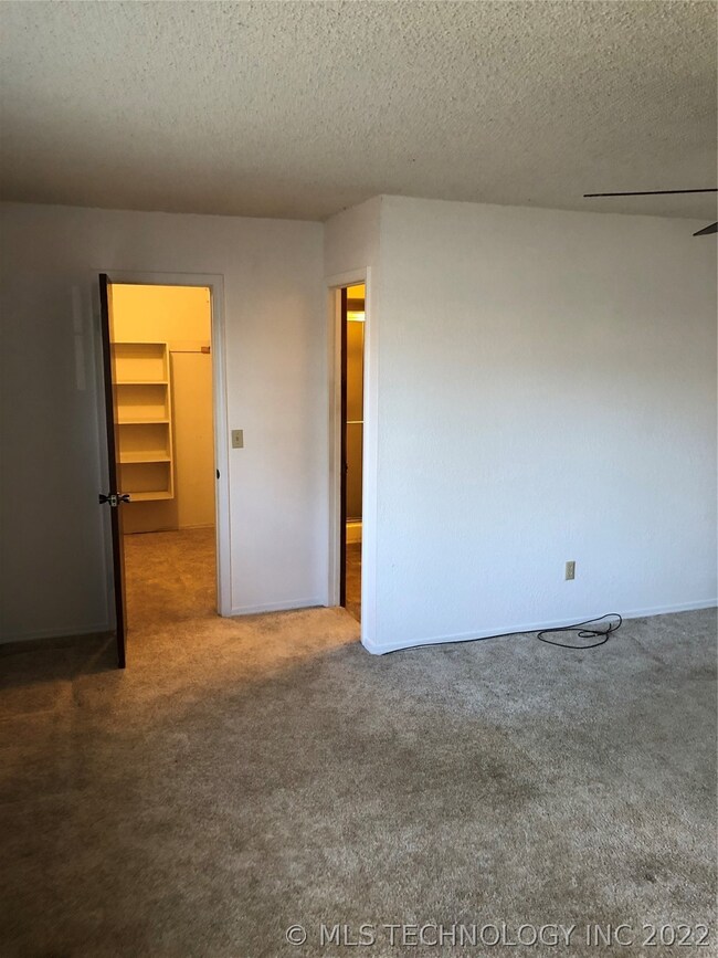 Master Bedroom Facing Larger Walk-In & Bathroom