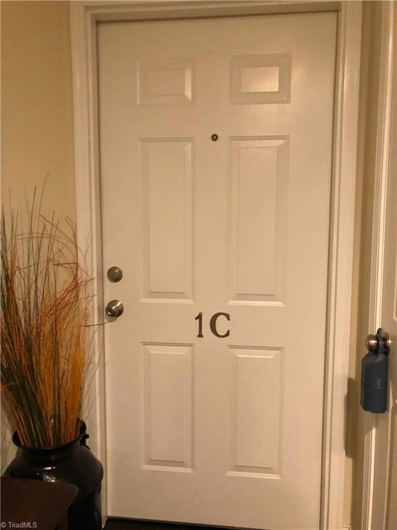 Entrance to condo with storage closet to the right