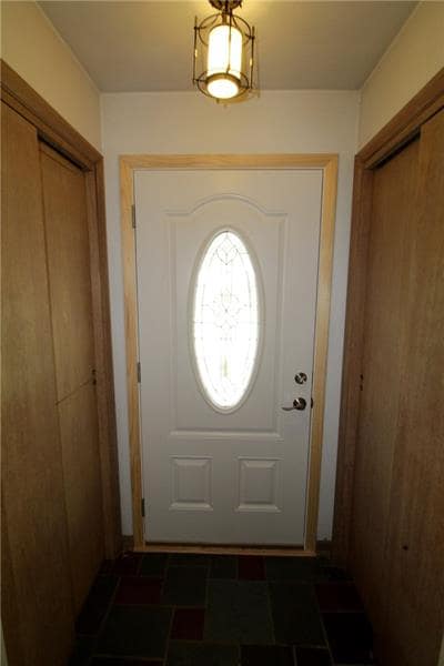 Entry with two closets.