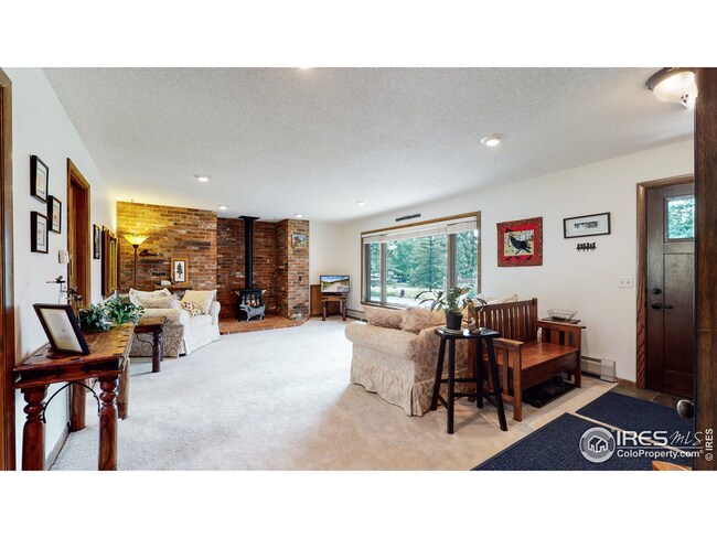 Gas stove in living room and big east-facing window