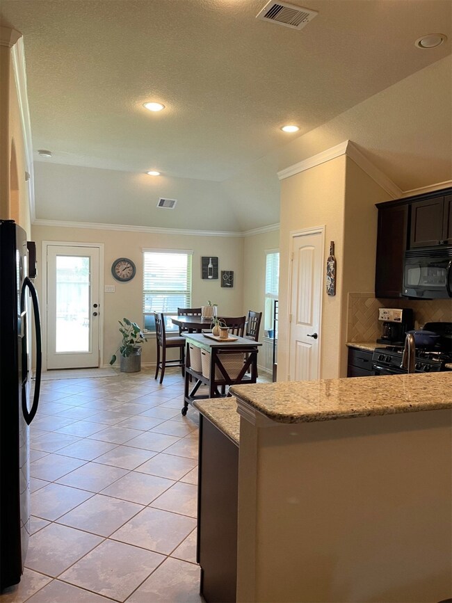 Kitchen open to breakfast area