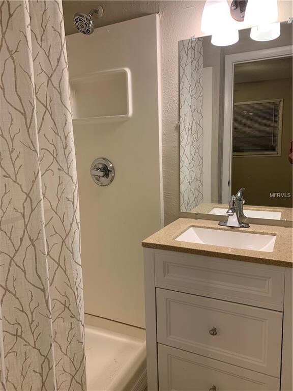 Updated master vanity and light fixture