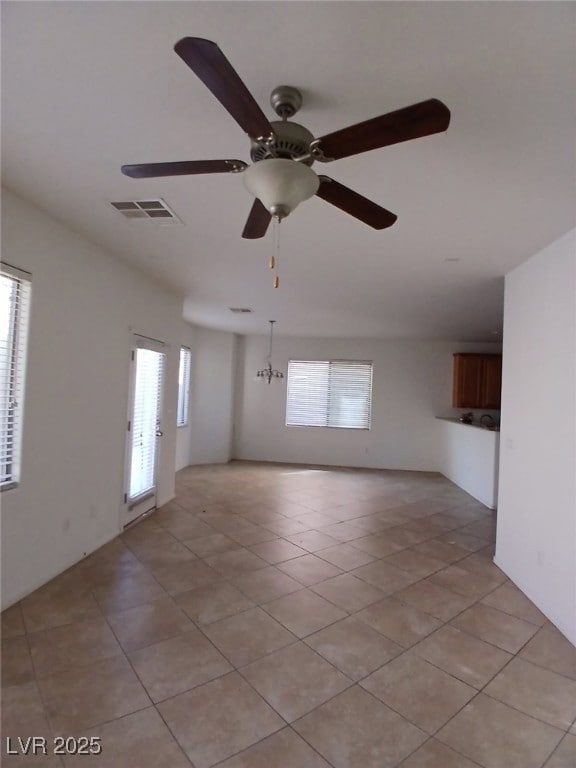 Unfurnished room featuring light tile patterned fl