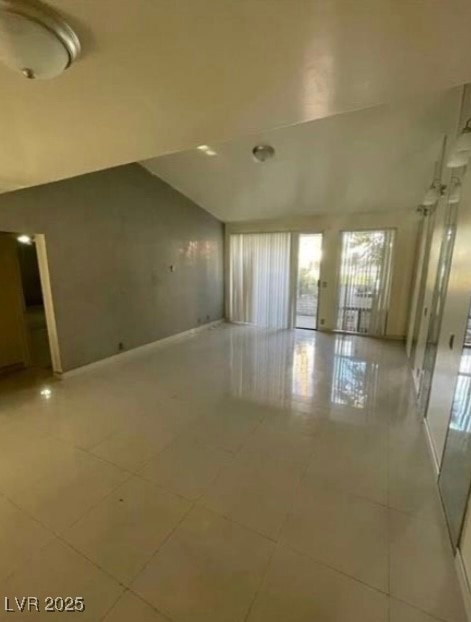 Spare room featuring light tile patterned floors a