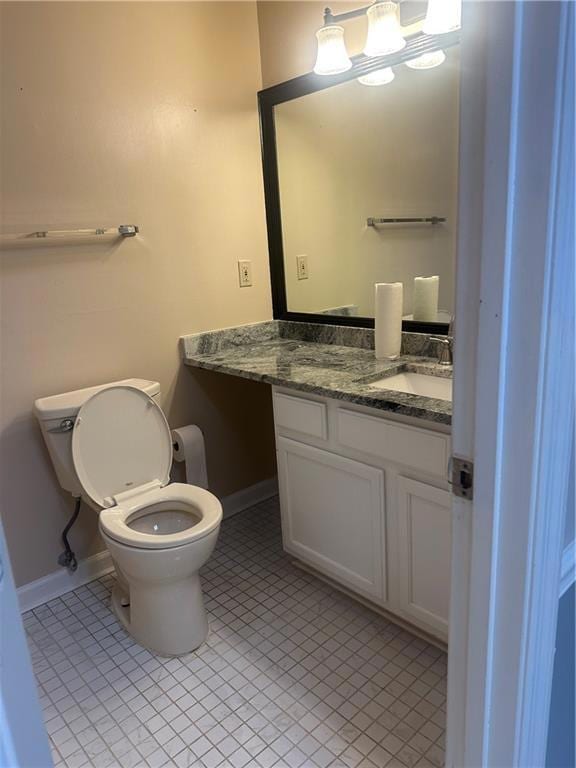 Bathroom with tile patterned flooring and vanity