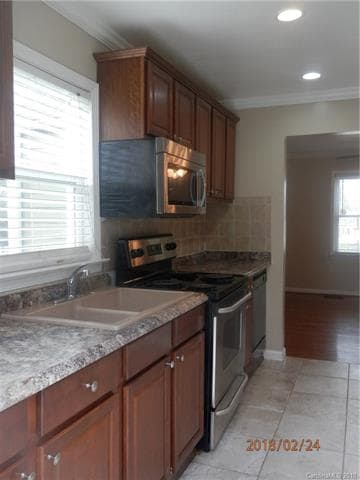 Kitchen with Stove, Dishwasher, Microwave.