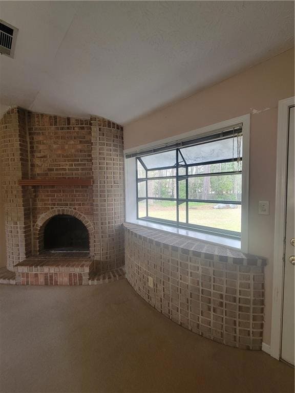 Unfurnished living room with carpet flooring, a br