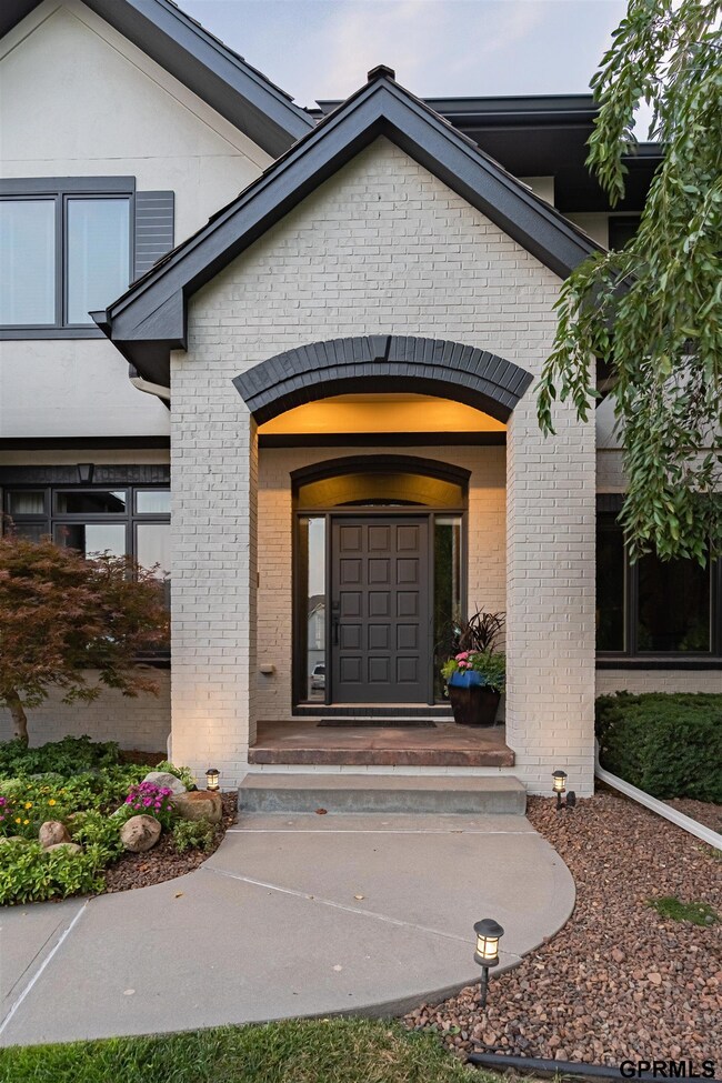 Front main entry featuring Iron Ore trim and front door colors with contrasting skyline steal house colors