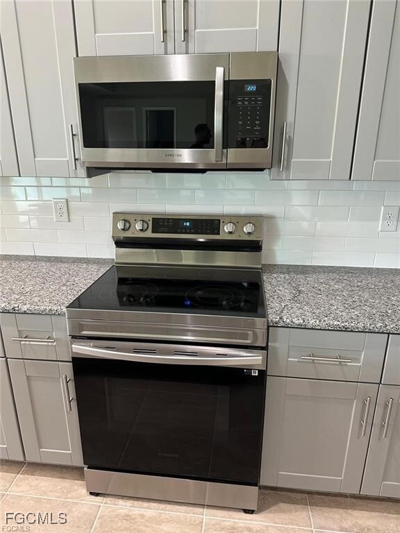 Kitchen with appliances with stainless steel finis