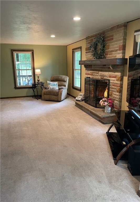 Get cozy in the roomy living room with a wood-burning, brick fireplace