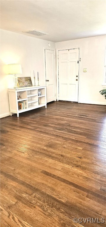 Foyer featuring wood finished floors and visible v