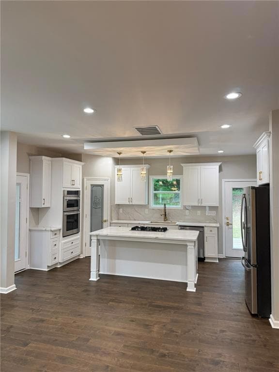 Split level home featuring covered porch, board an