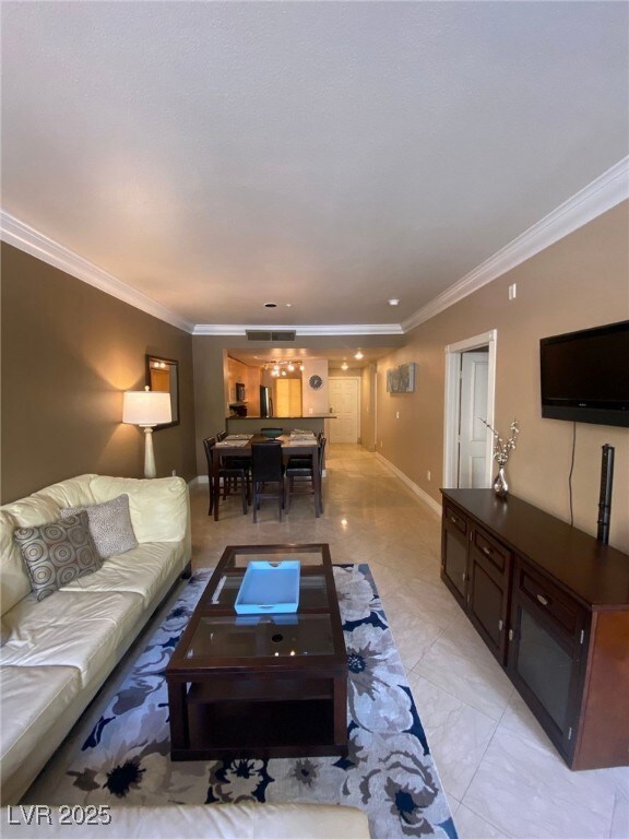 Living room featuring visible vents, marble finish