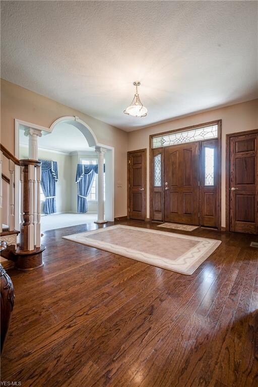 Welcome to lovely foyer with hardwood flooring . N