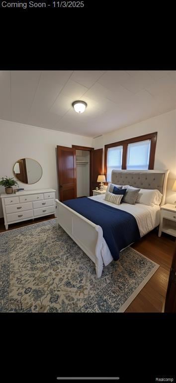 Living area featuring arched walkways, plenty of natural light, and dark wood-style flooring