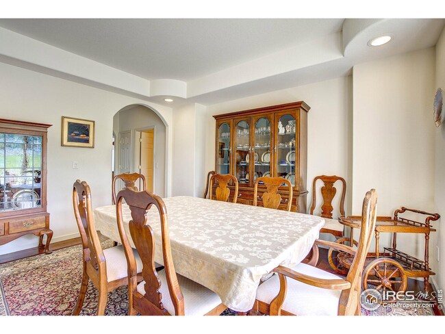 Main Level Dining Room, Open to Front Entry, Views to front of home, and access in walk way to Kitchen