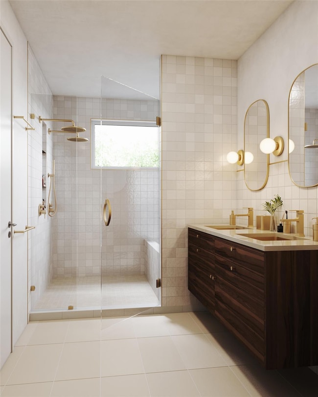 Full bath with vanity, tile walls, light tile pat