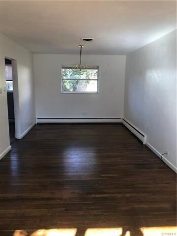 Living room/dining area nice wood floors lots of light