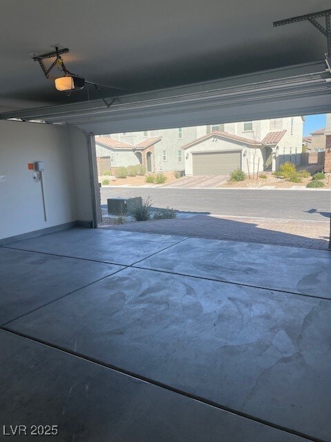 Garage featuring a garage door opener
